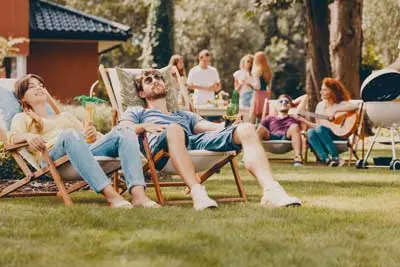 Two people sitting, summer picnic