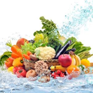 Fruit and vegetables being splashed with water representing staying hydrated.